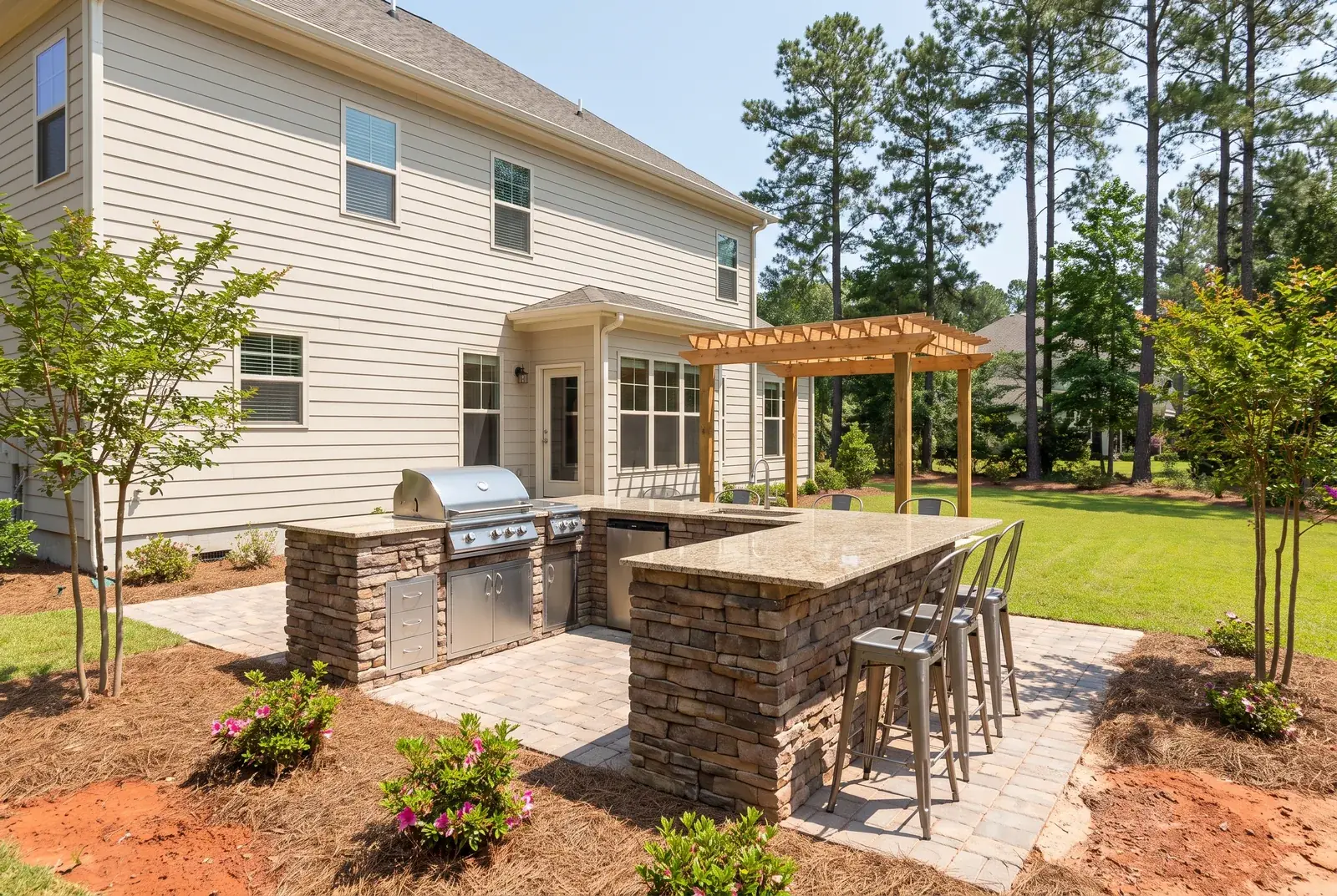 Full outdoor kitchen with built-in grill and counter