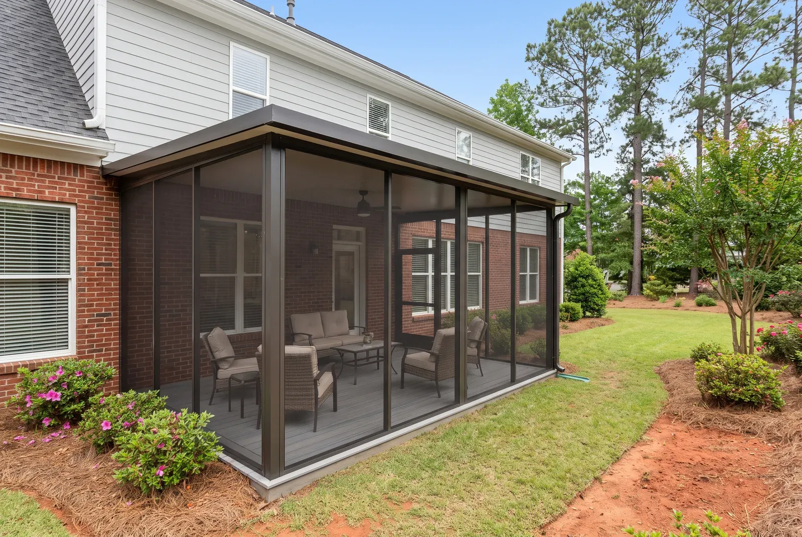 Modern flat-roof screen room off a Midlands home